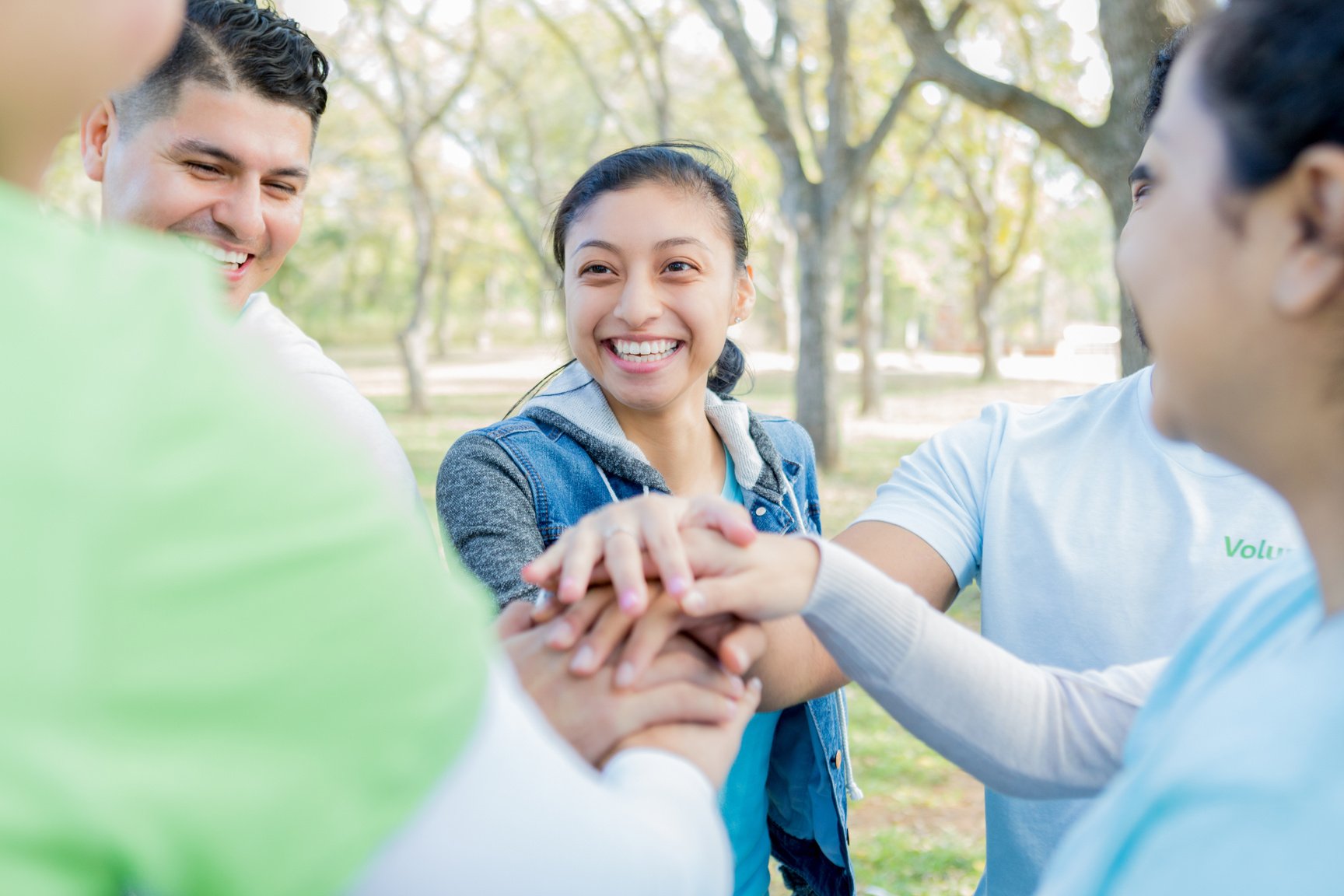 Cheerful group of people participate in neighborhood beautification