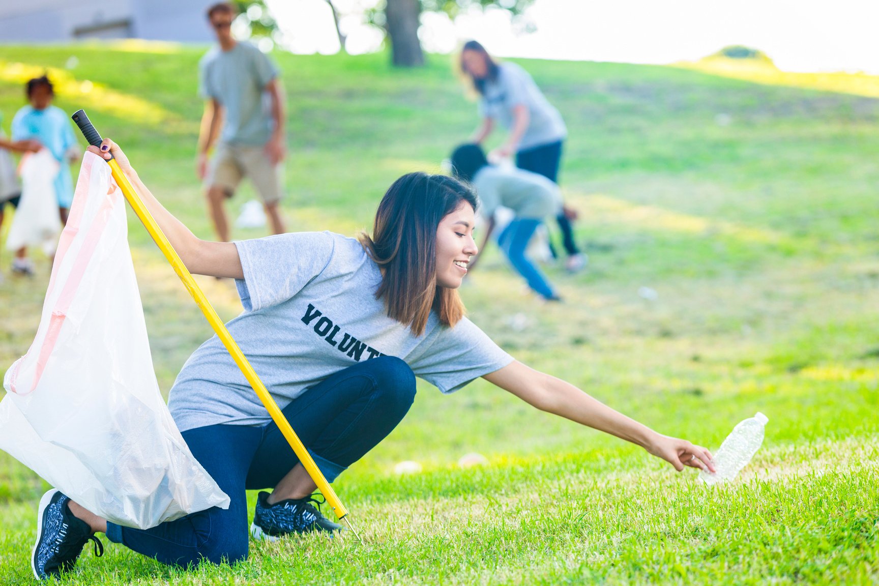 Woman helps neighbors clean up their neighborhood